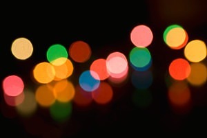 defocused bokeh image of colourful christmas fairy lights