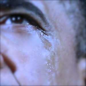 U.S. President Barack Obama appears with tears on his cheek during remarks at his final presidential campaign rally in Des Moines, Iowa